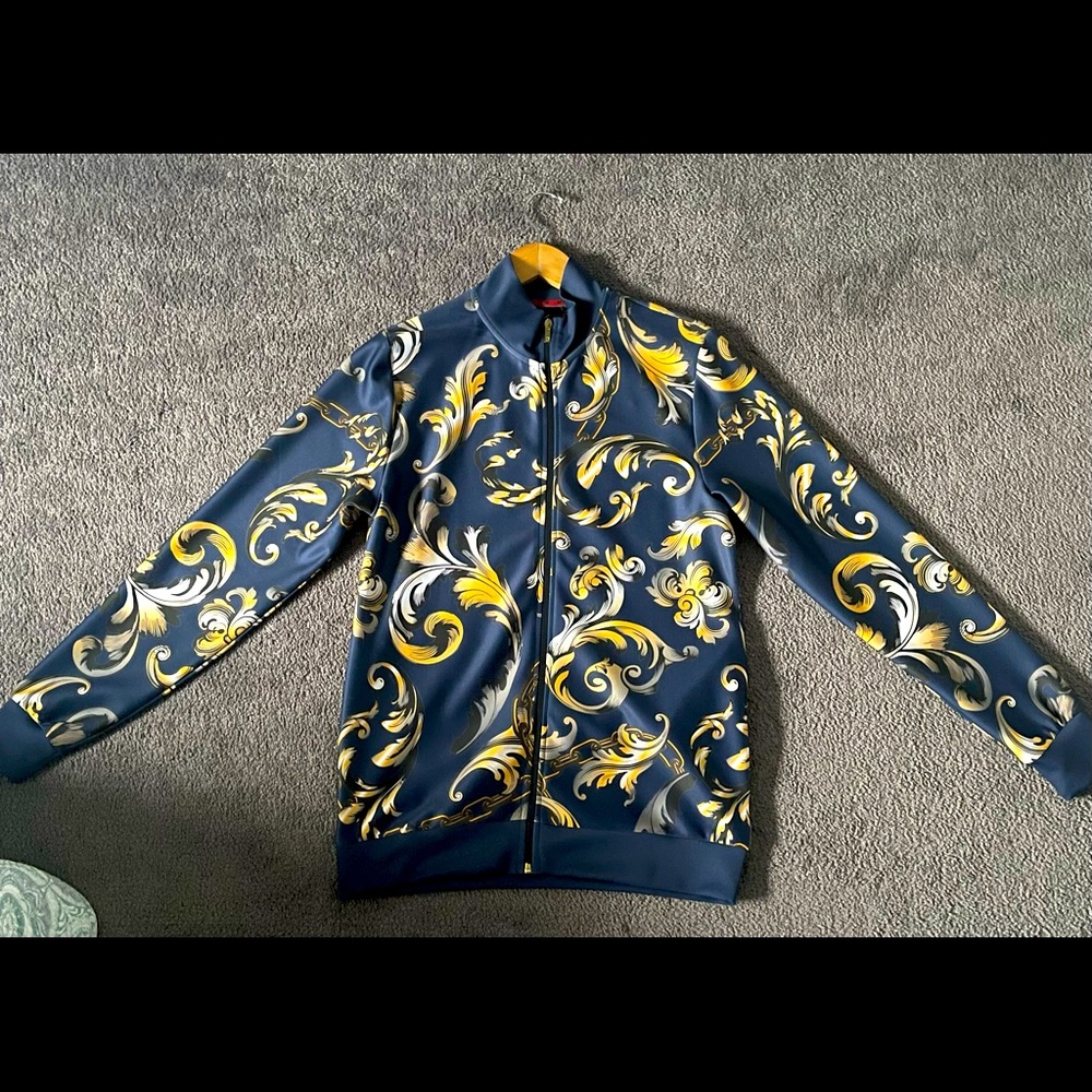 100% Polyester Navy blue and Gold designed outer jacket.